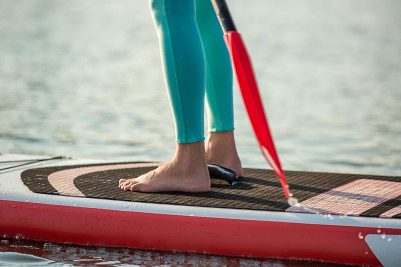 closeup woman on paddle board